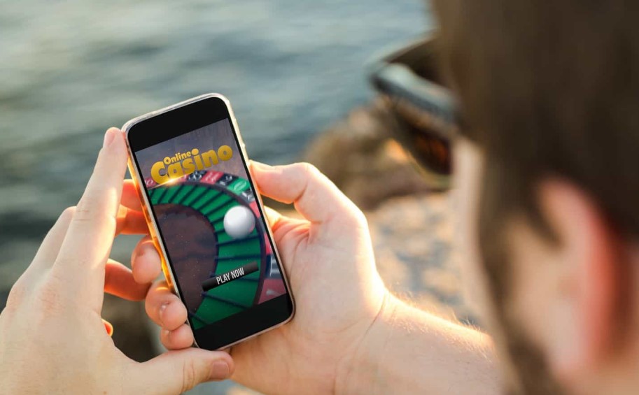 Man playing online casino with his phone